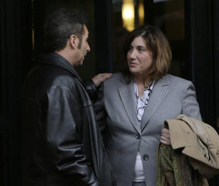 Matt Fuqua (L), brother of defendant Martha Fuqua, and the attorney for the Baltimore Museum of Art, Marla Diaz (R), talk outside of the U.S. District Court in Alexandria, Virginia January 10, 2014. REUTERS/Gary Cameron