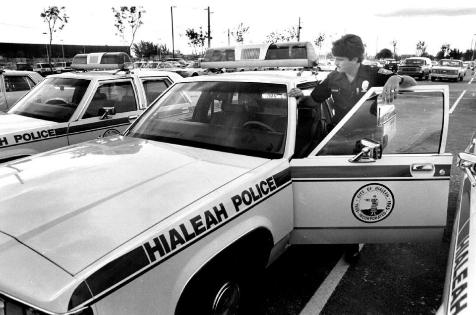 An Hialeah police officer officer checks out a new Fort LTD patrol car in 1988.