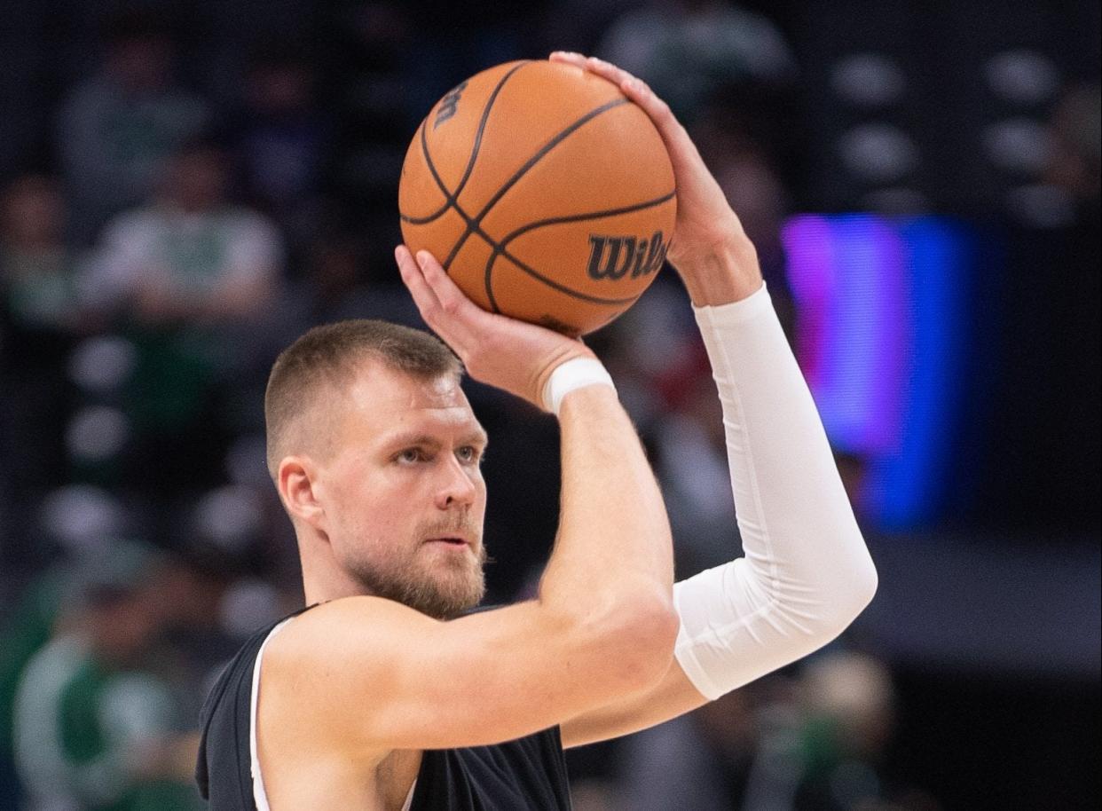 Dec 20, 2023; Sacramento, California, USA; Boston Celtics center Kristaps Porzingis (8) takes a jump shot during pregame warm ups at Golden 1 Center. Mandatory Credit: Ed Szczepanski-USA TODAY Sports