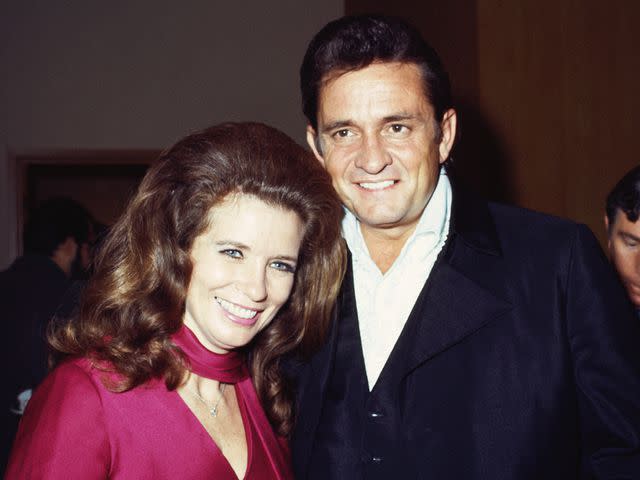 <p>Michael Ochs Archives/Getty</p> Johnny Cash and June Carter Cash pose for a portrait at an event in September 1969.