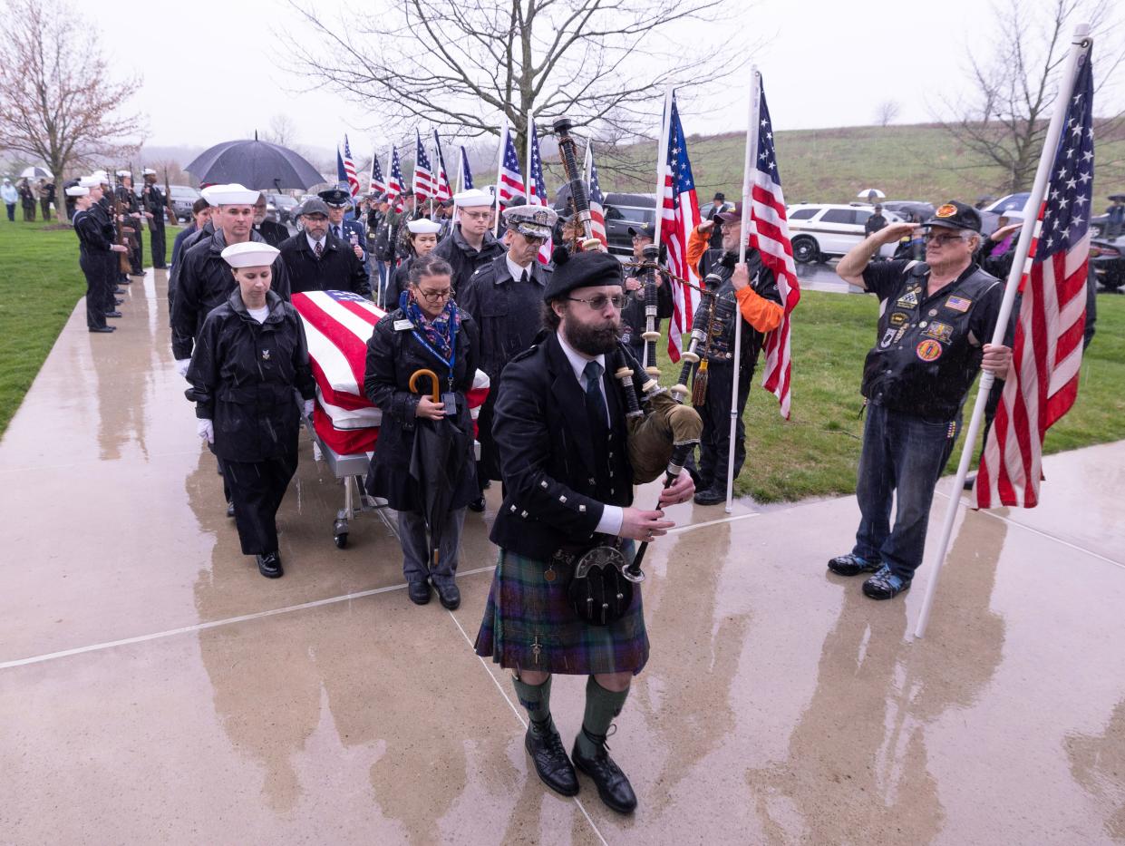 A U.S. Navy funeral detail escorts the remains of Fireman 1st Class Walter Schleiter to a military funerals service during his military funeral at National Cemetaries of the Alleghanies in Bridgeville PA, Thursday April 11, 2024.