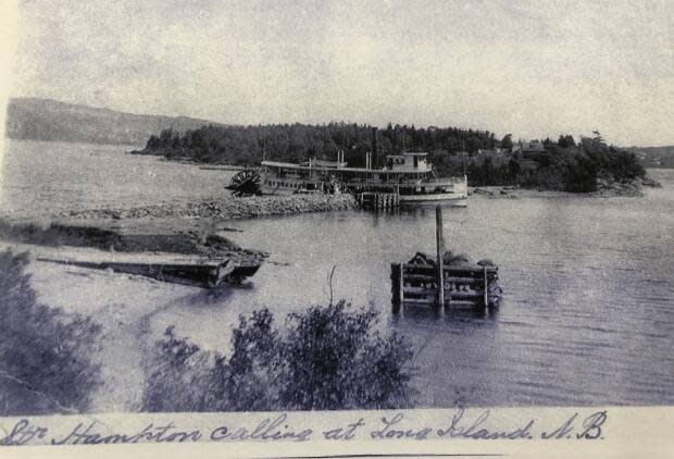 A photo by H.W.H. Swann shows the riverboat Hampton stopping at Long Island in the early 1900s  The Hampton, the last riverboat to travel to the island, made its final run in 1921.
