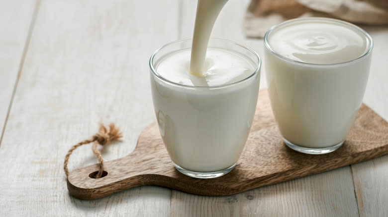 Buttermilk in jar pouring glass