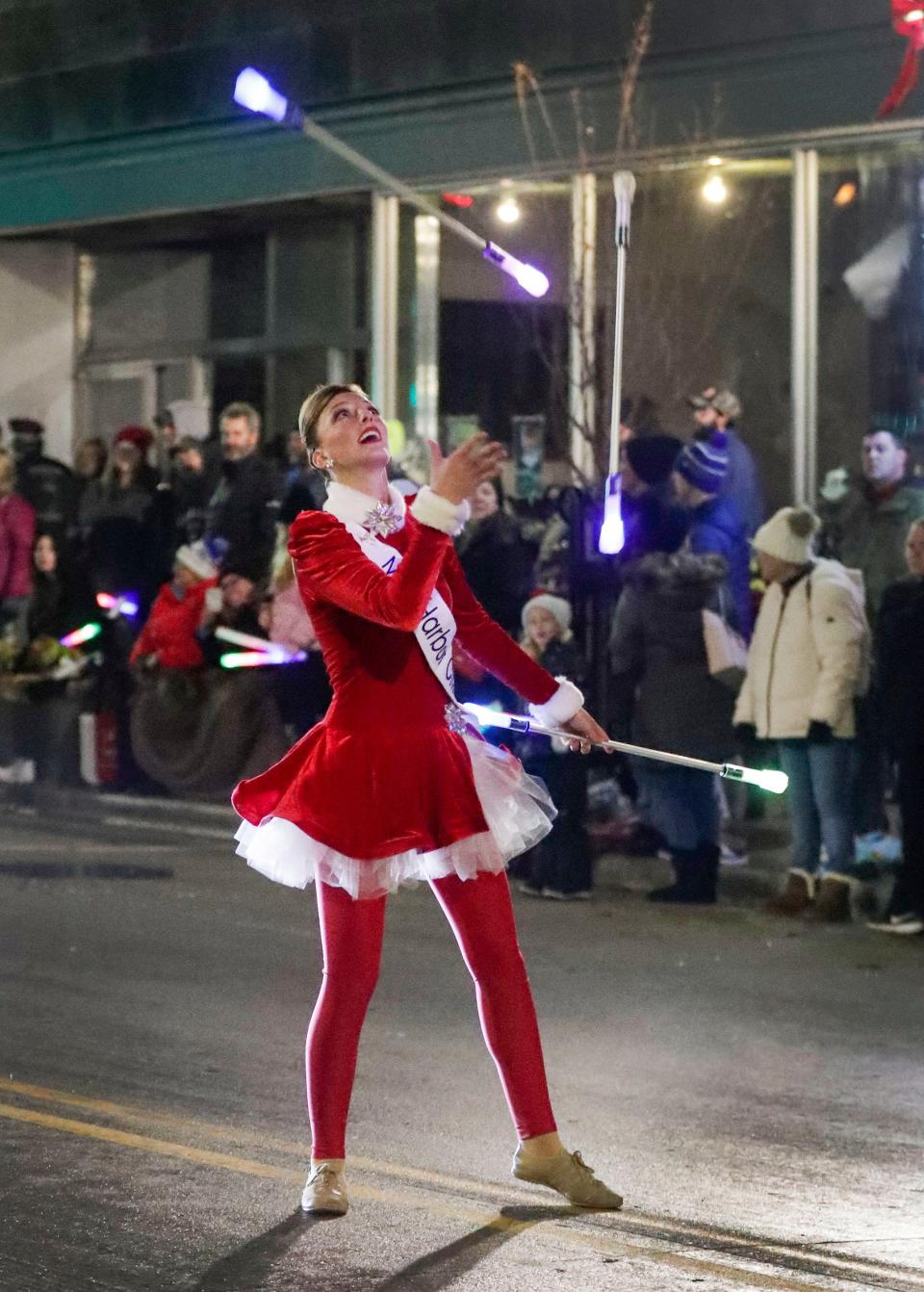 FILE - Kylene Spanbauer juggles batons during the Manitowoc Lakeshore Holiday Parade Nov. 23, 2022, in Manitowoc.