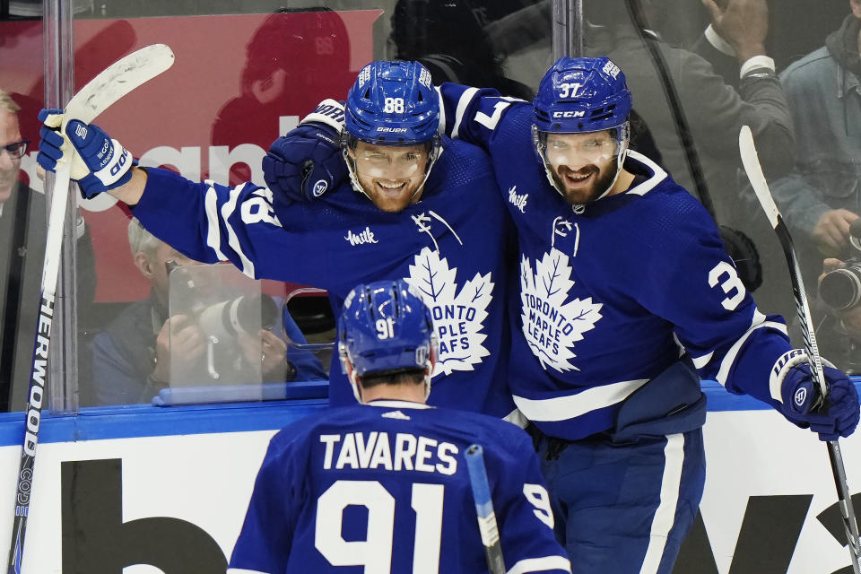 Toronto Maple Leafs' William Nylander (88) celebrates after his goal against the Boston Bruins with John Tavares (91) and Timothy Liljegren (37) during second-period action in Game 6 of an NHL hockey Stanley Cup first-round playoff series in Toronto, Thursday, May 2, 2024. (Frank Gunn/The Canadian Press via AP)