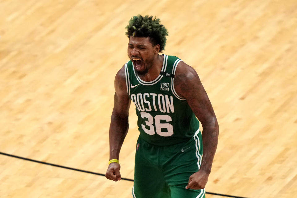 Boston Celtics guard Marcus Smart returned to the NBA playoffs healthy after a triple-double with just one rebound against the Miami Heat.  (Eric Espada/Getty Images)