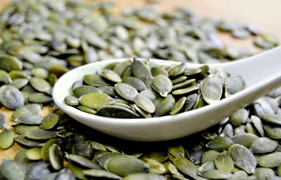 Pumpkin seeds on a spoon