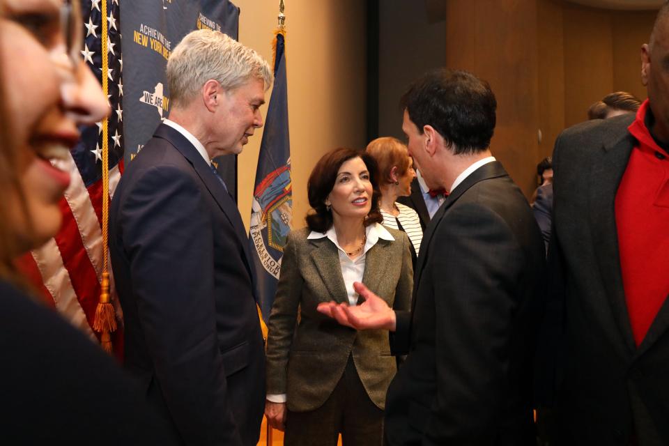 Gov. Kathy Hochul chats with New Rochelle Mayor Noam Bramson, right, and White Plains Mayor Tom Roach after speaking about the state's housing crisis with Westchester business leaders at the Business Council of Westchester in Rye Brook March 15, 2023.
