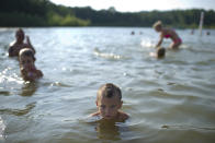 Parker Farrell, 2, cools off in the lake at Millenium Park in Grand Rapids, Mich., as temperatures rose to a high of 96 degrees on Thursday, June 28, 2012. (AP Photo/The Grand Rapids Press, Matthew Busch)