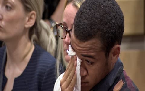 Zachary Cruz cries as his brother, Nikolas Cruz is arraigned at the Broward County Courthouse in Fort Lauderdale - Credit: AP