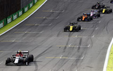 Antonio Giovinazzi of Italy driving the (99) Alfa Romeo Racing C38 Ferrari leads Daniel Ricciardo of Australia driving the (3) Renault Sport Formula One Team RS19 on track during the F1 Grand Prix of Brazil at Autodromo Jose Carlos Pace - Credit: Getty Images South America