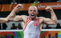 <p>Denmark’s Mark Overgaard Madsen reacts after winning against Hungary’s Peter Bacsi a semi-final of the men’s Greco-Roman wrestling 75-kg competition at the 2016 Summer Olympics in Rio de Janeiro, Brazil, Sunday, Aug. 14, 2016. (AP Photo/Markus Schreiber) </p>