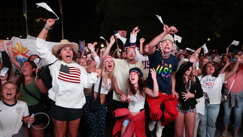 Attendees cheer after the International Olympic Committee awarded the 2034 Winter Olympic Games to the Salt Lake City-Utah Committee during a live watch party held at the Salt Lake City and County Building in Washington Square Park on Wednesday, July 24, 2024, in downtown Salt Lake City.