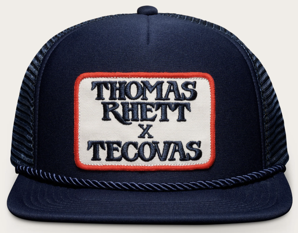 navy blue hat that reads "Thomas Rhett x Tecovas"
