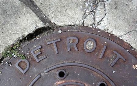 'Detroit' is seen on the top of an iron man-hole cover on a street in Detroit, Michigan in this file photo taken July 27, 2013. REUTERS/ Rebecca Cook/Files