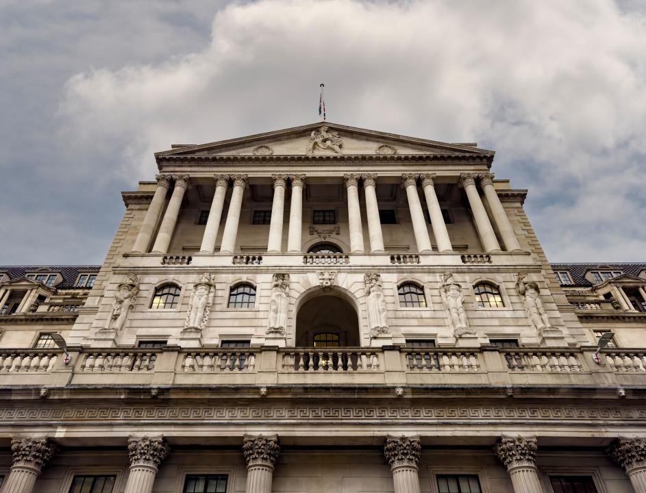 Bank of England exterior façade with cloudy grey sky. London. UK
