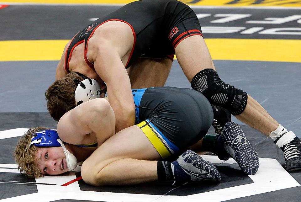Ontario’s Mason Turnbaugh wrestles Steubenville’s Cal Beadling during their match at the OHSAA State Wrestling Championships Saturday, March 9, 2024 at the Jerome Schottenstein Center. TOM E. PUSKAR/MANSFIELD NEWS JOURNAL