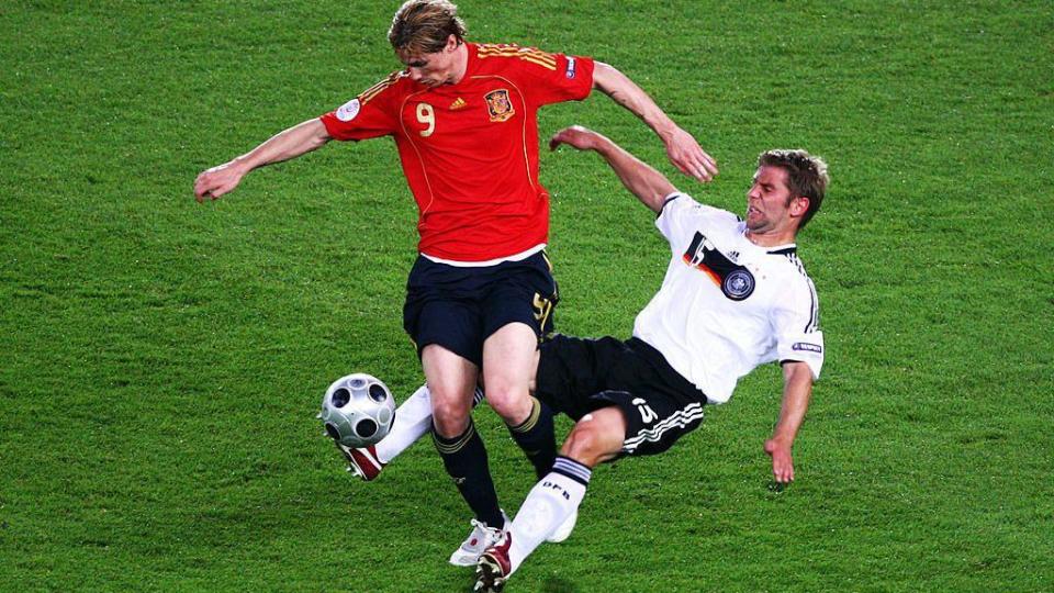 Thomas Hitzlsperger challenges Spain's Fernando Torres during the final of Euro 2008