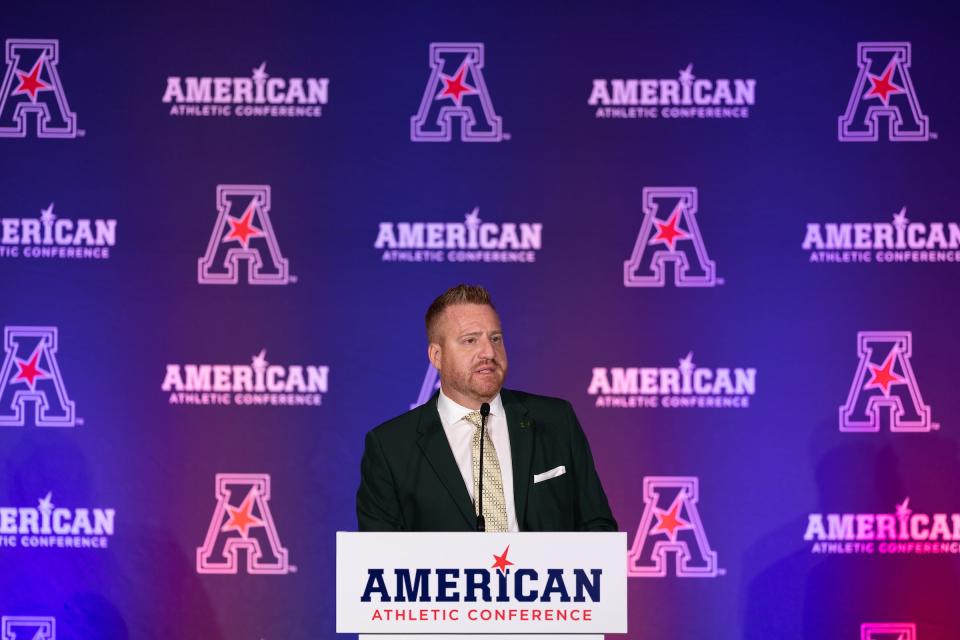 South Florida football coach Alex Golesh speaks at the American Athletic Conference Kickoff Football Media day on July 23, 2024, in Arlington, Texas.