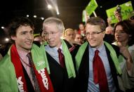 MONTREAL - DECEMBER 2: Newly elected Liberal Party Leader Stephane Dion (C) is congratulated by Gerard Kennedy (R) and Justin Trudeau (L) after delivering his victory speech at the Palais de congres in Montreal, Quebec, Canada. Dion will lead the Liberals into the next election against Stephen Harper's Conservatives. (Photo by Simon Hayter/Getty Images)