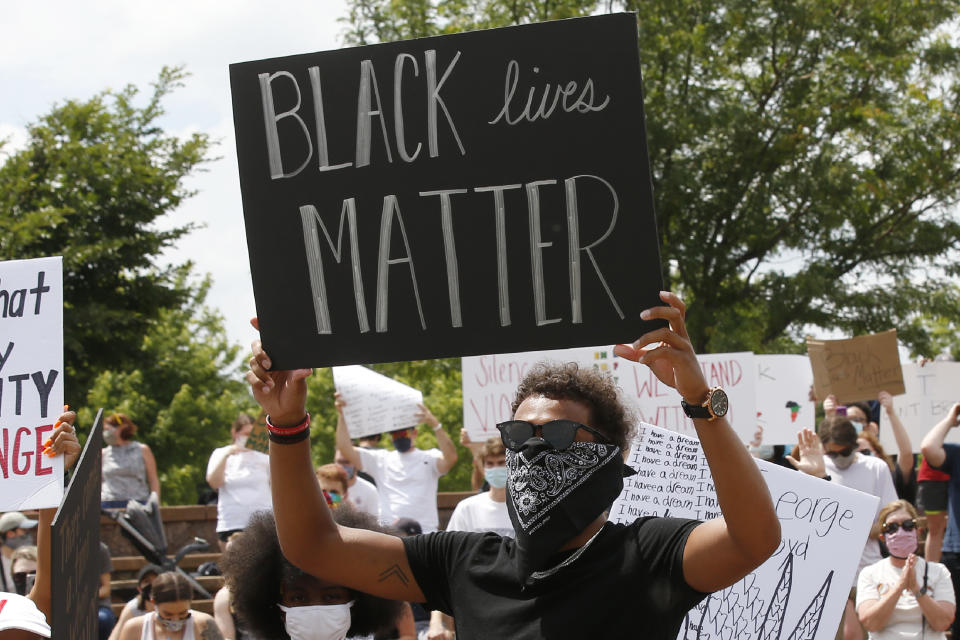 Trae Young spoke at a peaceful protest in his hometown of Norman, Okla. on Monday. (AP Photo/Sue Ogrocki)