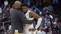 FILE - Cleveland Cavaliers coach J.B. Bickerstaff gives Donovan Mitchell a hug during the second half of Game 5 of the team's NBA basketball first-round playoff series against the New York Knicks, Wednesday, April 26, 2023, in Cleveland. The Cavaliers have waited a year to redeem themselves in the NBA playoffs. Their chance starts Saturday against the Orlando Magic. (AP Photo/Phil Long, File)