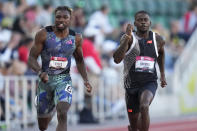 FILE - Noah Lyles competes against Trayvon Bromell in the men's 100 meter semi-finals during the U.S. track and field championships in Eugene, Ore., Friday, July 7, 2023. (AP Photo/Ashley Landis, File)