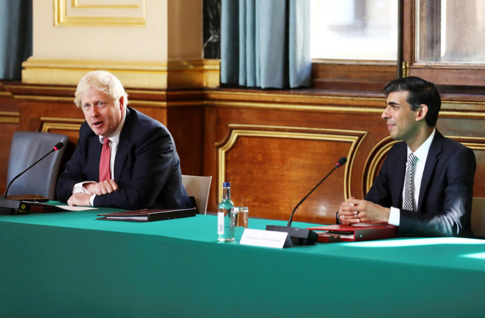 LONDON, ENGLAND - JULY 21: Prime Minister Boris Johnson sits beside Chancellor of the Exchequer Rishi Sunak during a face-to-face meeting of his cabinet team of ministers, the first since mid-March, at the Foreign and Commonwealth Office (FCO) on July 21, 2020 in London, England. The meeting in the FCO will take place in a ventilated room in the Foreign Office large enough to allow ministers to sit at least one metre apart. (Photo by Simon Dawson - WPA Pool/Getty Images)