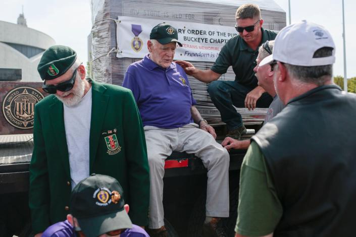 Before his death earlier this month, Marnie Corps veteran Tom Beck, center, worked with Purple Heart Chapter 500, an organization that helped those who, like him, had served their country.