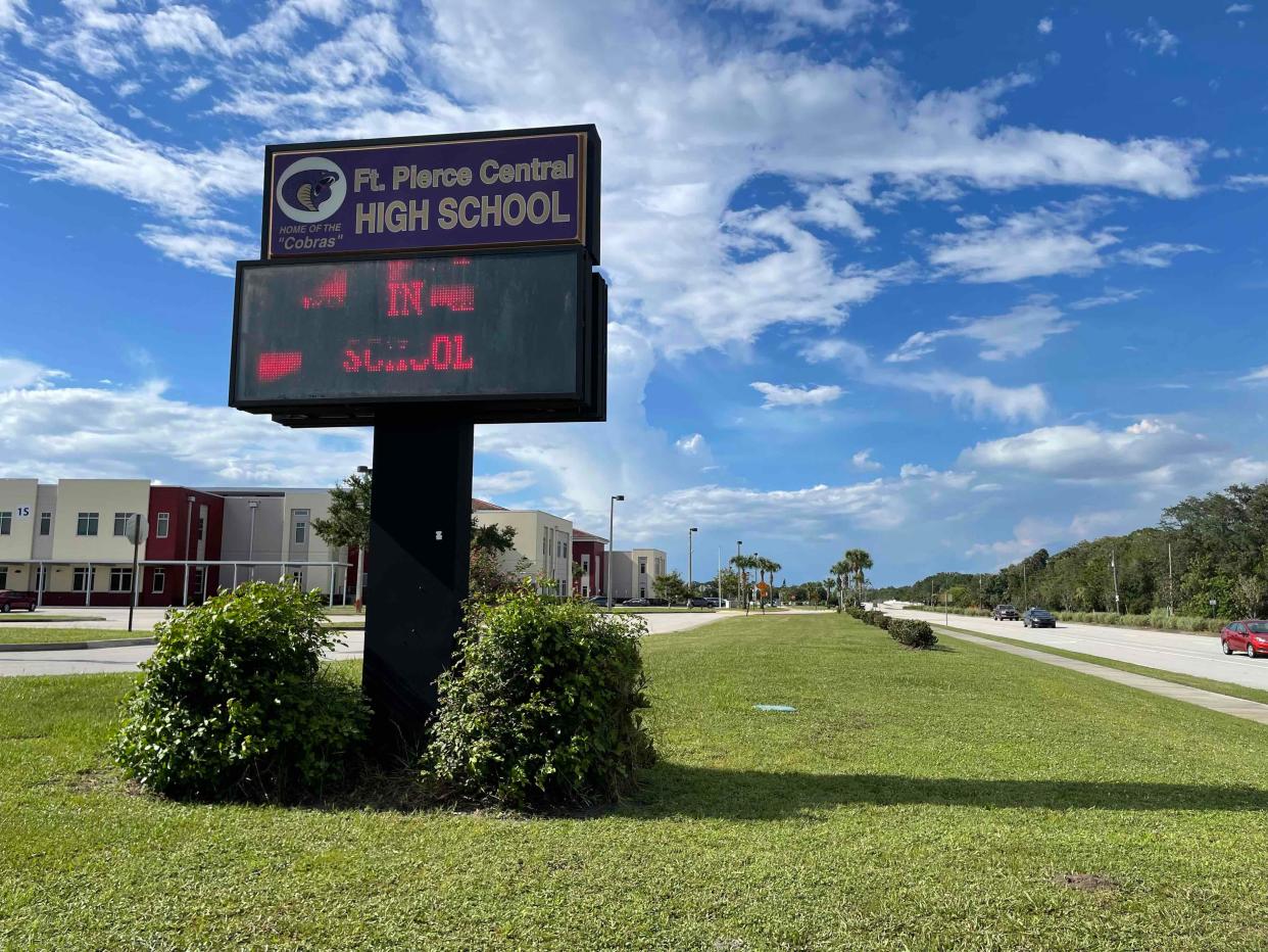 Students found a dead man on a field near Fort Pierce Central High School's campus.