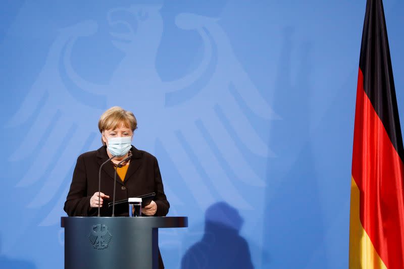 FILE PHOTO: German Chancellor Angela Merkel arrives for a news conference after a virtual meeting with federal state governors at the chancellery in Berlin