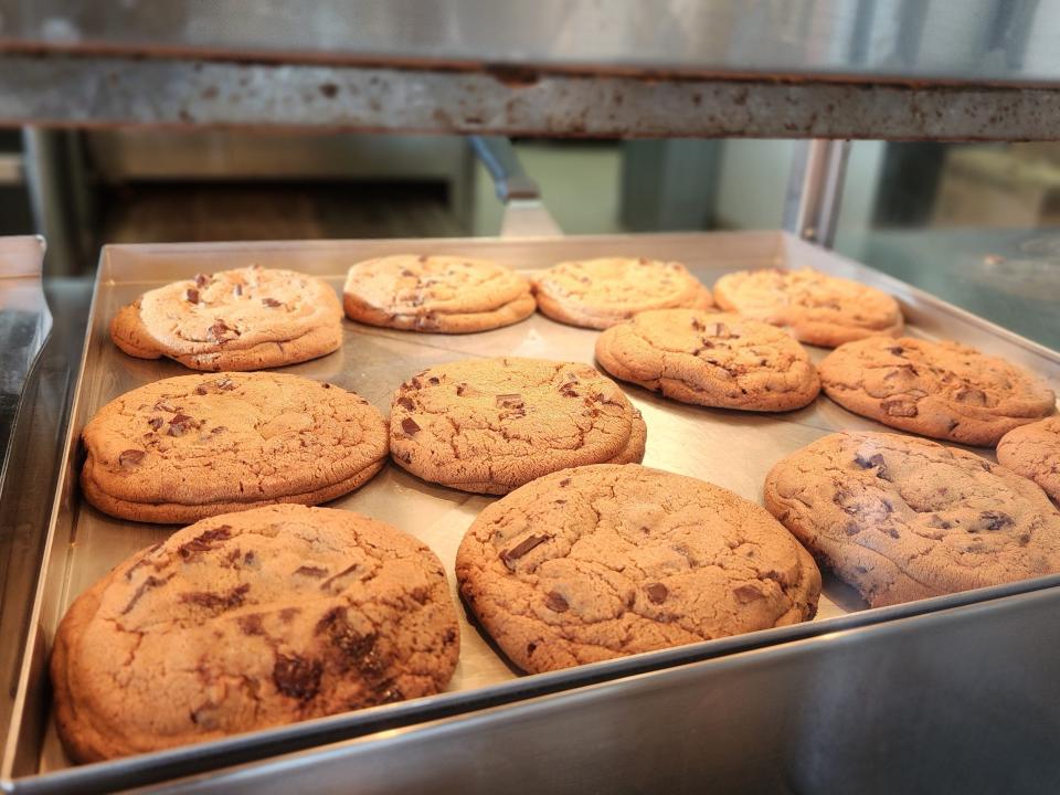 Tray of golden-brown chocolate-chip cookies through window at Costco's food court