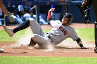 Cleveland Guardians' Tyler Freeman scores on an RBI double by Austin Hedges in the second inning of a baseball game against the Toronto Blue Jays in Toronto, Sunday, Aug. 14, 2022. (Jon Blacker/The Canadian Press via AP)