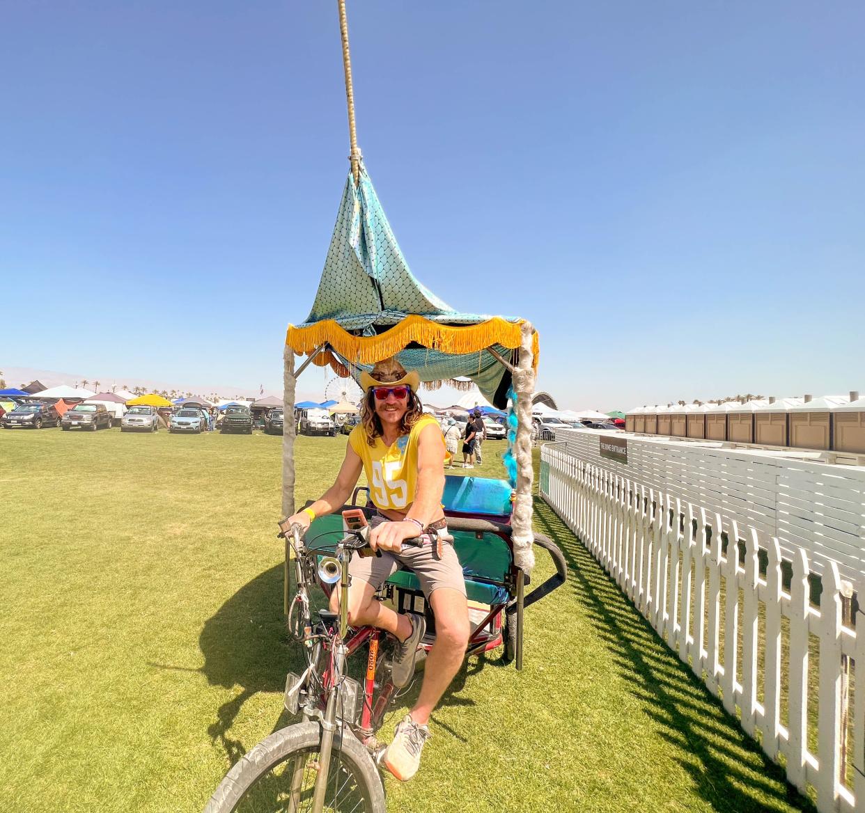 Thomas "Dukaroo" Kelley is working the Coachella Valley Arts and Musical Festival as a pedicab driver for the first time this year, in Indio, Calif., on April 14, 2023.