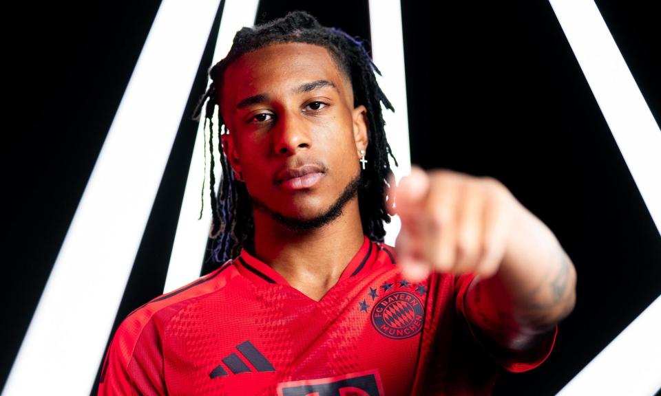 <span>Michael Olise models the Bayern shirt after finalising his move.</span><span>Photograph: Bayern Munich Twitter</span>