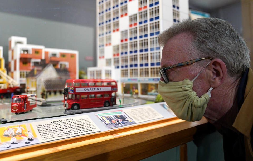 <p>Greg Hoar looks at a display case featuring Arkitex and Spot-On models during a preview for 'Life before Lego', a new exhibition of Britain's best remembered building toys, which will open to the public on June 30 at Wimborne Model Town and Gardens in Wimborne Minster, Dorset. Picture date: Wednesday June 23, 2021.</p>
