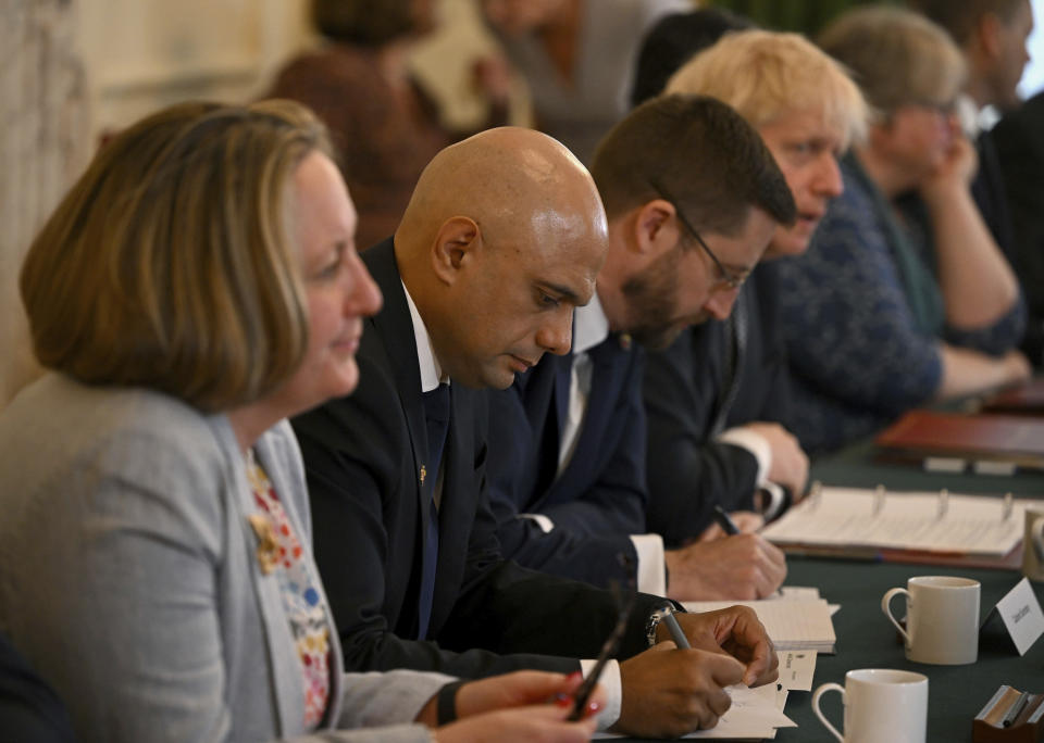 From left, Britain's International Trade Secretary Anne-Marie Trevelyan, Health Secretary Sajid Javid, Cabinet Secretary and Head of the Civil Service Simon Case, and Prime Minister Boris Johnson during a Cabinet meeting at 10 Downing Street, London, Tuesday, July 5, 2022. Two of Britain’s most senior Cabinet ministers have quit in a move that could spell the end of Prime Minister Boris Johnson’s leadership after months of scandals. Treasury chief Rishi Sunak and Health Secretary Sajid Javid resigned within minutes of each other Tuesday. (Justin Tallis/Pool Photo via AP)