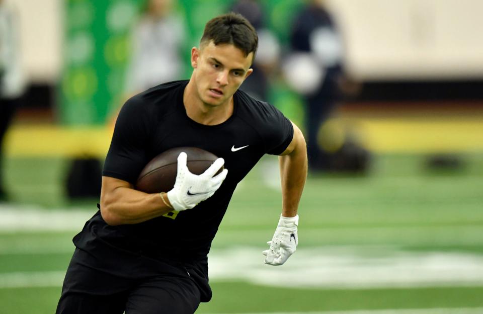 Former Oregon player and Olympian Devon Allen participates in a drill during Oregon's NFL Pro Day, Friday, April 1, 2022, in Eugene, Ore.