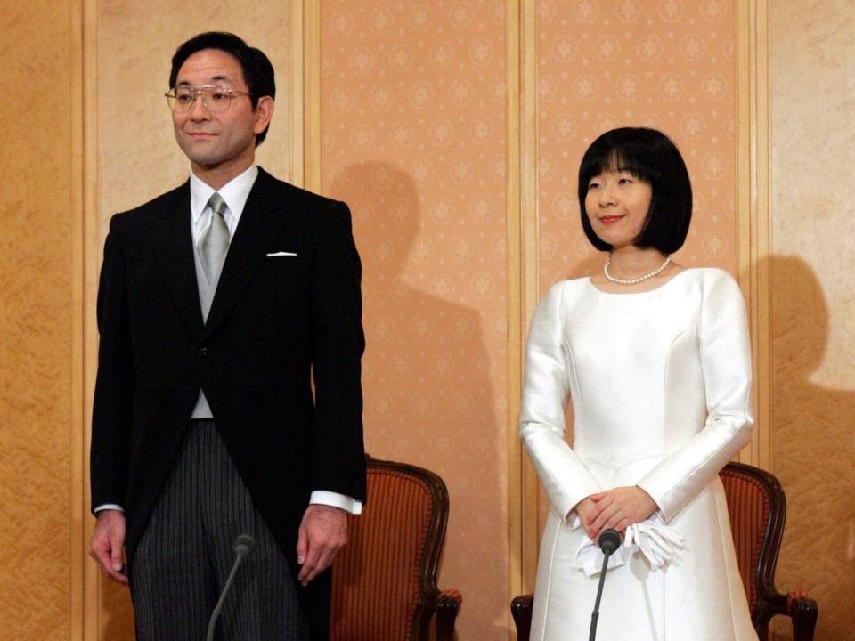 Sayako Kuroda wears a plain white dress on her wedding day.