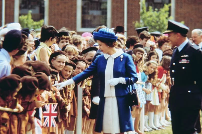 Queen Elizabeth II greets a group of brownies