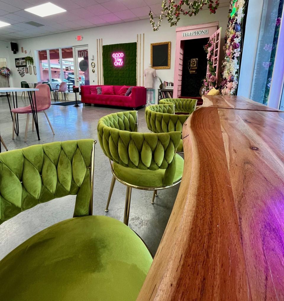 Inside seating at Cadeau Café includes tables, chairs and sofas.