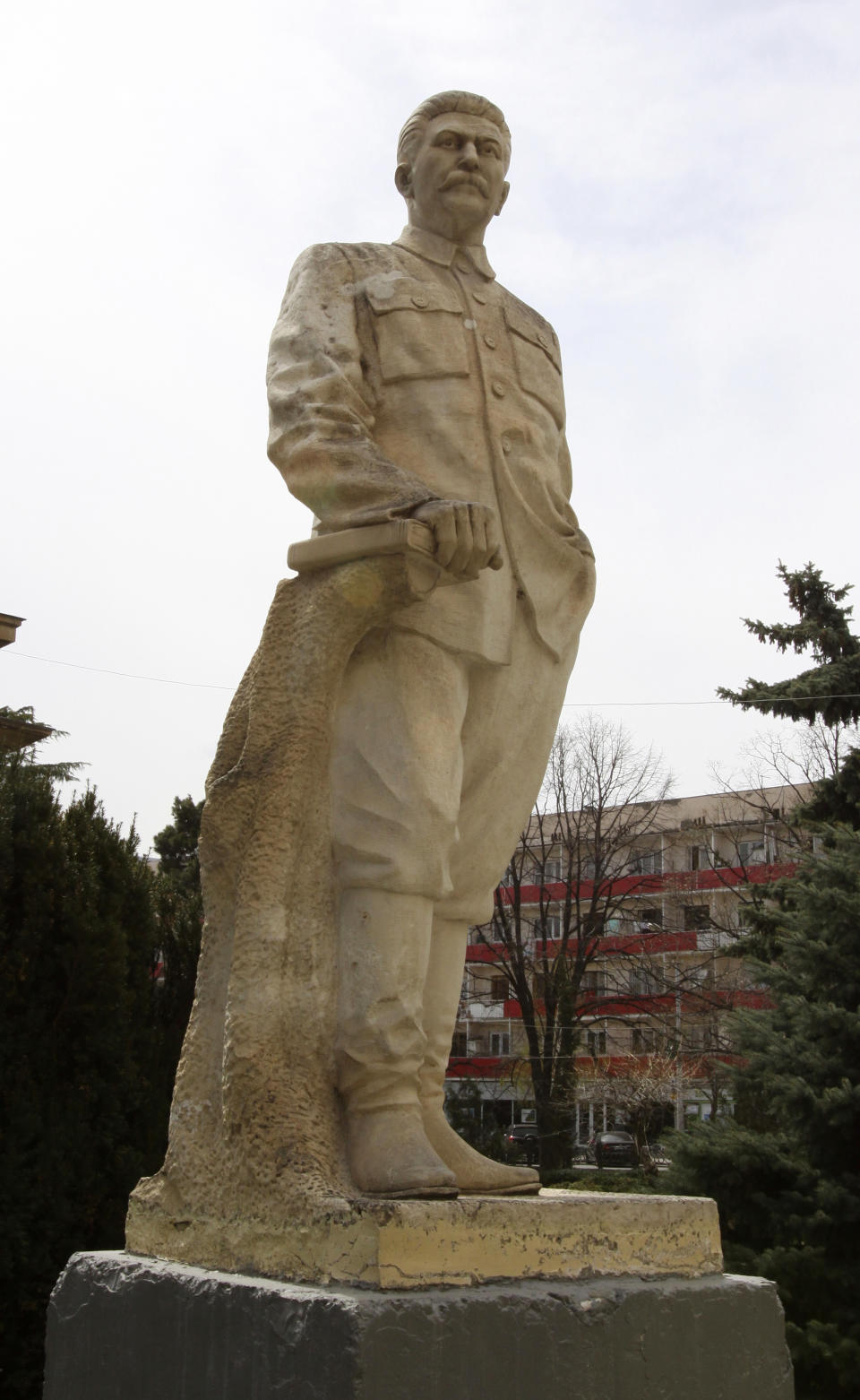 A statue of Soviet dictator Josef Stalin is seen at the entrance to a museum dedicated to him in the town of Gori, some 80 kilometers (50 miles) west of the Georgian capital Tbilisi, Monday, April 9, 2012. A museum that has honored Josef Stalin in Georgia since 1937 is being remodeled to exhibit the atrocities that were committed during the Soviet dictator's rule. (AP Photo/Shakh Aivazov)