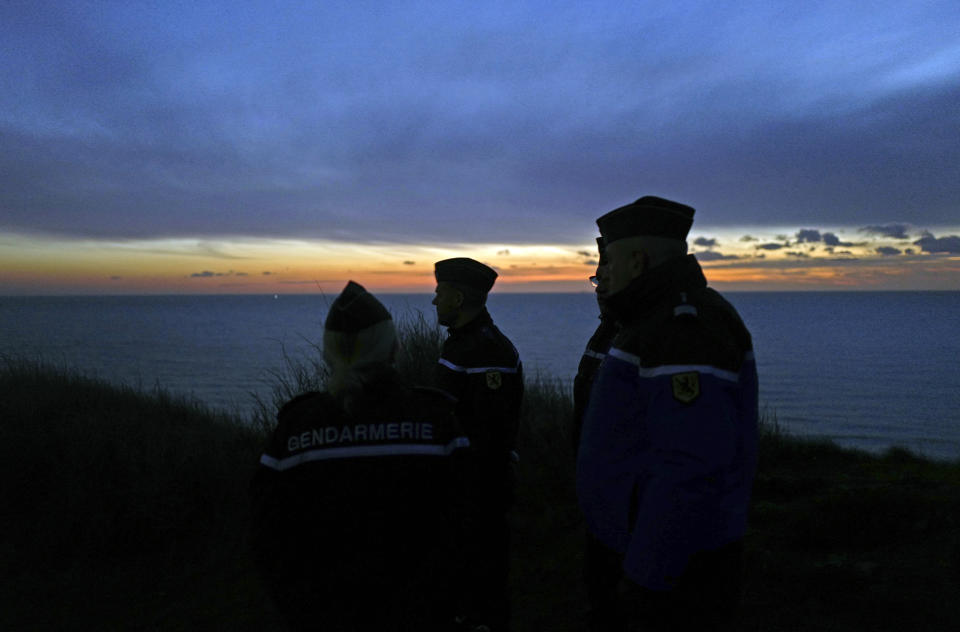 French gendarmes patrol the beach in Ambleteuse near Calais, northern France, Friday, Jan. 18, 2019. Land, sea and air patrols are combing the beaches, dunes and frigid, murky coastal waters of northern France in a bid to end an unusual high-risk tactic by migrants, mostly Iranians: trying to sneak across the English Channel in rubber rafts. (AP Photo Michel Spingler)