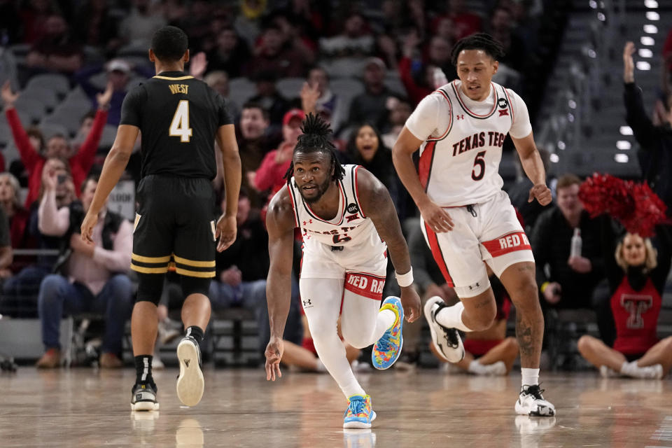 Texas Tech guard Joe Toussaint (6) celebrates after sinking a three-point basket in the second half of an NCAA college basketball game against Vanderbilt in Fort Worth, Texas, Saturday, Dec. 16, 2023. (AP Photo/Tony Gutierrez)