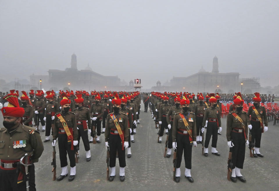 Indian army soldiers march during rehearsals for the upcoming Republic Day parade at the Raisina hills, the government seat of power, in New Delhi, India, Monday, Jan. 18, 2021. Republic Day marks the anniversary of the adoption of the country's constitution on Jan. 26, 1950. Thousands congregate on Rajpath, a ceremonial boulevard in New Delhi, to watch a flamboyant display of the country’s military power and cultural diversity. (AP Photo/Manish Swarup)