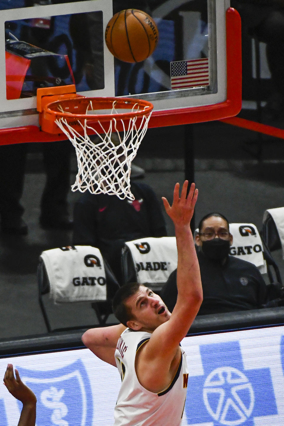 Denver Nuggets center Nikola Jokic shoots against the Chicago Bulls during the first half of an NBA basketball game Monday, March 1, 2021, in Chicago. (AP Photo/Matt Marton)