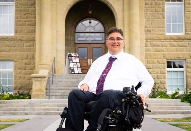 Kent Hehr, the former Liberal MP and MLA, bowed out of Calgary's mayoral race on Tuesday morning.  (Hehrformayor.ca - image credit)