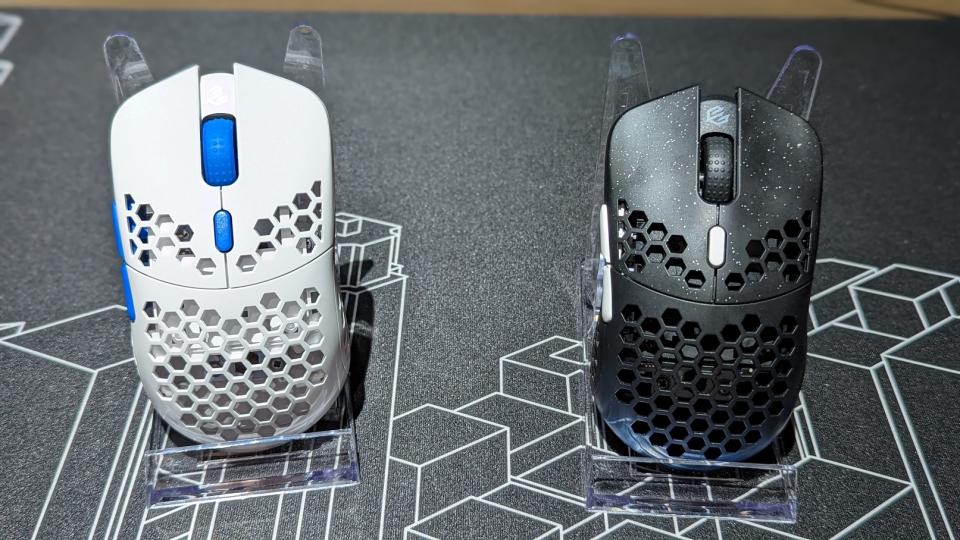 A picture of two wireless mice from G-Wolves, one black and blue, and one white and blue. (Photo: Yahoo Gaming SEA)