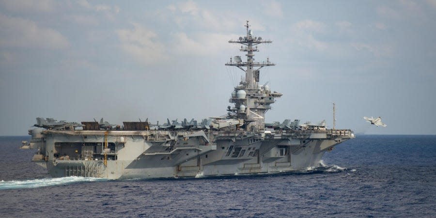 An F/A-18F Super Hornet, assigned to the “Black Knights” of Strike Fighter Squadron (VFA) 154, launches from the flight deck of the aircraft carrier USS Theodore Roosevelt (CVN 71) March 18, 2020.