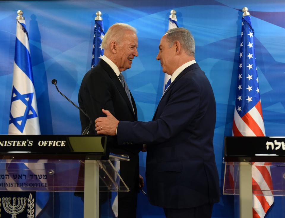 Then-Vice President Joe Biden and Israeli Prime Minister Benjamin Netanyahu shake hands in Jerusalem in 2016. <a href="https://media.gettyimages.com/id/514445026/photo/israel-us-diplomacy.jpg?s=612x612&w=gi&k=20&c=PBZ4CbxoPrZQmfKDOCNRMhKUQQZDFjQK6bzqqQDiNMg=" rel="nofollow noopener" target="_blank" data-ylk="slk:Debbie Hill/AFP via Getty Images;elm:context_link;itc:0;sec:content-canvas" class="link ">Debbie Hill/AFP via Getty Images</a>